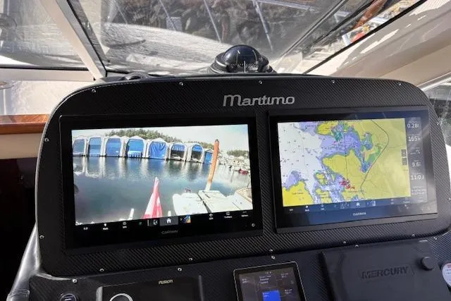 Dolce Far Niente Yacht Photos Pics Dashboard of a 2012 Maritimo C53 Sports Cabriolet with navigation screens.