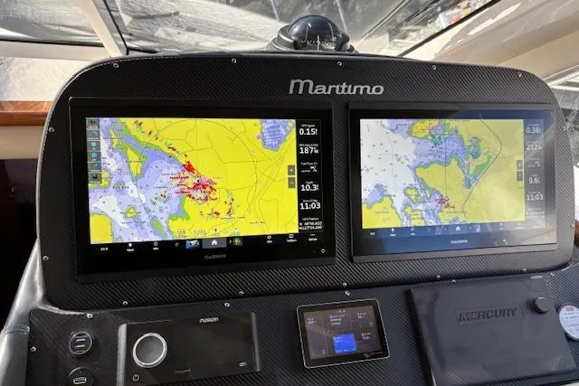 Dolce Far Niente Yacht Photos Pics Dashboard of 2012 Maritimo C53 Sports Cabriolet with navigation screens and controls.