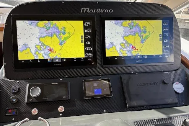 Dolce Far Niente Yacht Photos Pics Dashboard of a 2012 Maritimo C53 Sports Cabriolet with dual navigation screens.