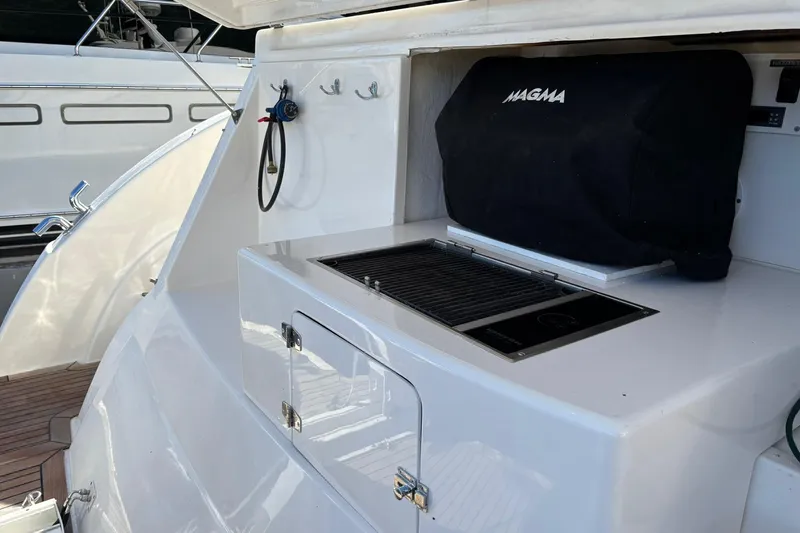 Dolce Far Niente Yacht Photos Pics Outdoor grill on 2012 Maritimo C53 Sports Cabriolet yacht deck.