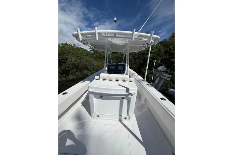  Yacht Photos Pics 2013 Contender 35 LS boat interior with console and T-top under clear sky.