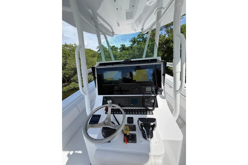  Yacht Photos Pics 2013 Contender 35 LS boat helm with advanced navigation and control systems.