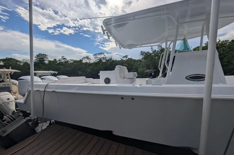  Yacht Photos Pics 2013 Contender 35 LS boat docked under a partly cloudy sky.