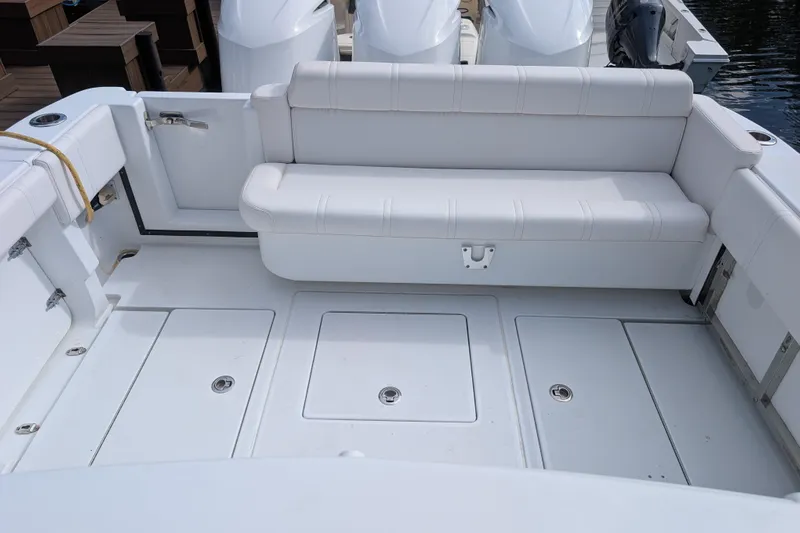 Yacht Photos Pics 2013 Contender 35 LS boat interior with white seating and storage compartments.