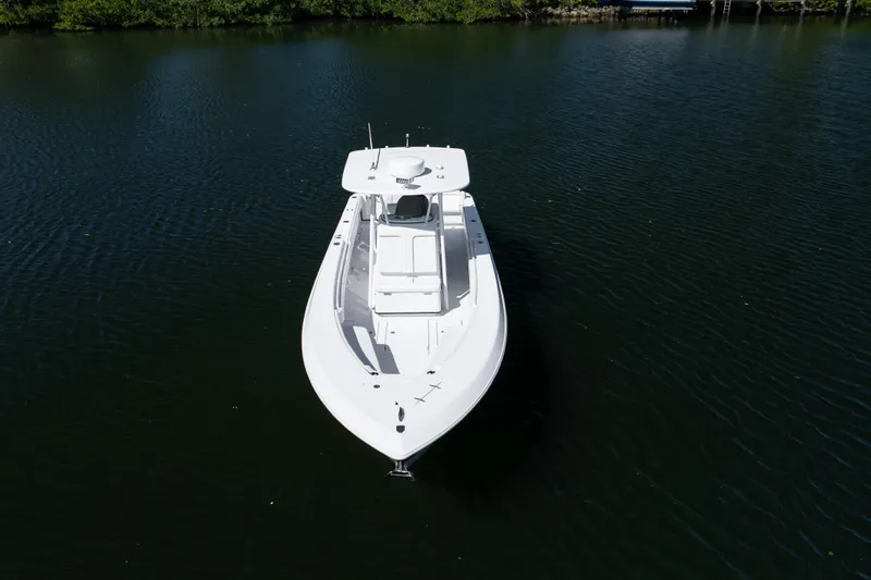  Yacht Photos Pics 2013 Contender 35 LS boat on calm water, aerial view.