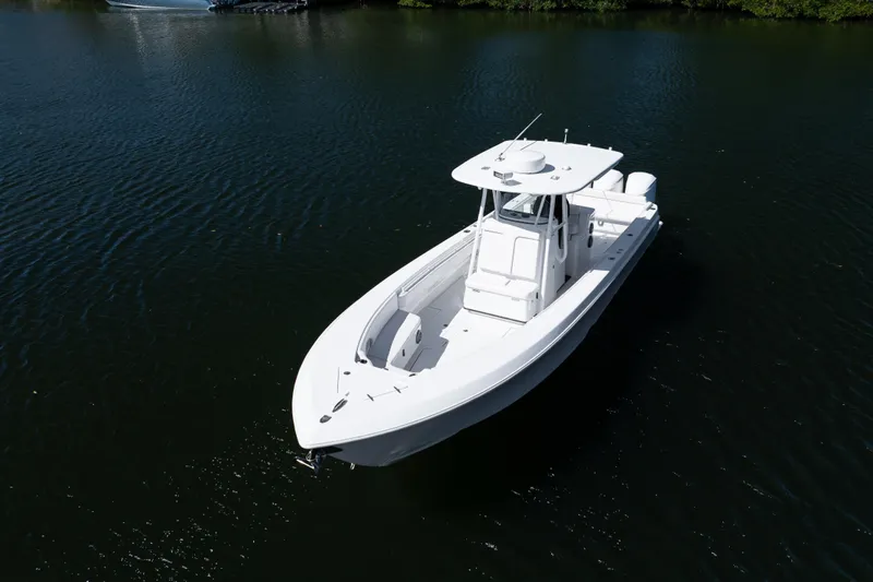  Yacht Photos Pics 2013 Contender 35 LS boat on calm water, aerial view.