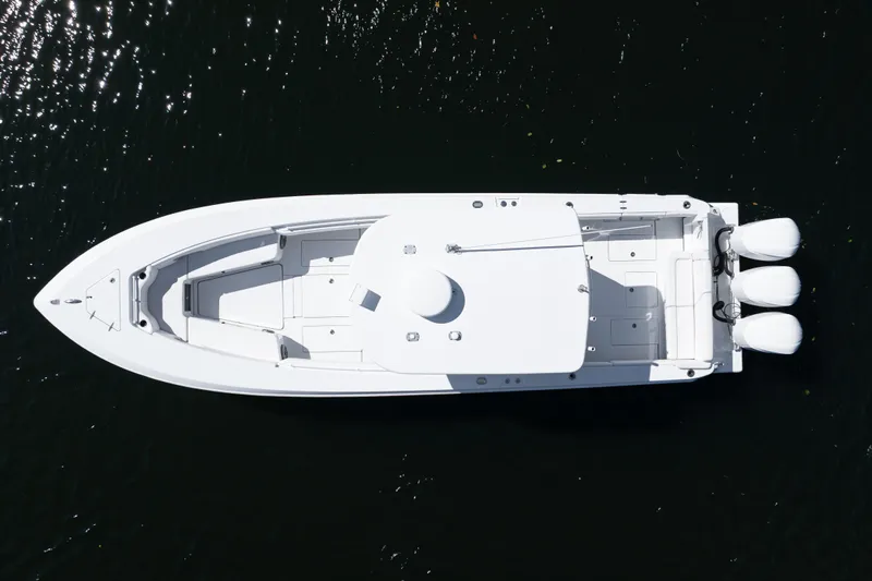  Yacht Photos Pics Aerial view of 2013 Contender 35 LS boat with triple outboard engines.