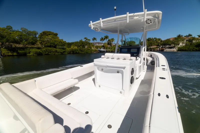  Yacht Photos Pics 2013 Contender 35 LS boat on water, featuring spacious deck and modern design.