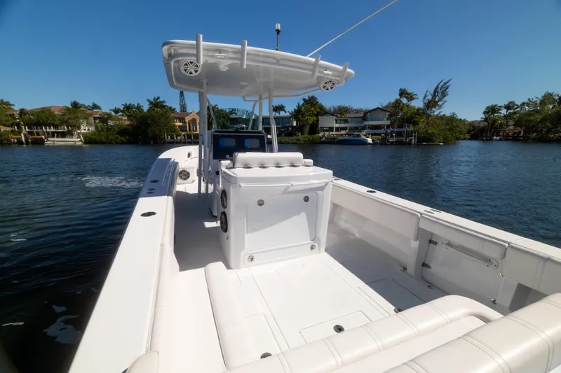  Yacht Photos Pics 2013 Contender 35 LS boat on calm water, featuring spacious deck and modern design.