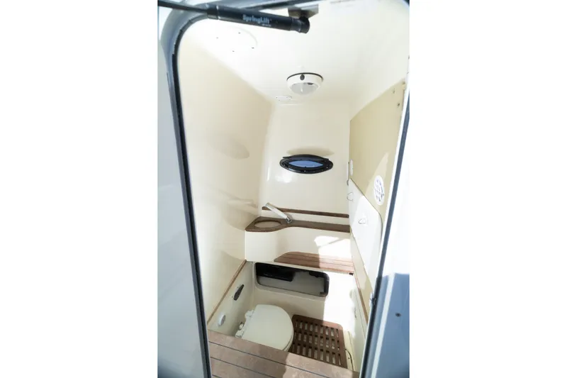  Yacht Photos Pics 2013 Contender 35 LS boat interior cabin with compact bathroom amenities.