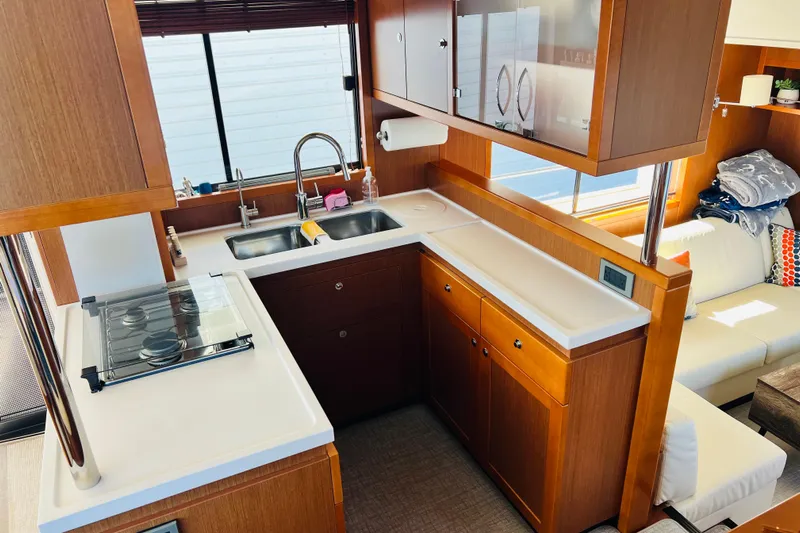 Billy Yacht Photos Pics Luxurious kitchen interior of 2014 Beneteau Swift Trawler 50 with modern amenities.