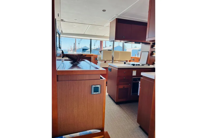 Billy Yacht Photos Pics Interior of 2014 Beneteau Swift Trawler 50, featuring modern kitchen and seating area.