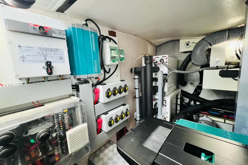 Billy Yacht Photos Pics Engine room of a 2014 Beneteau Swift Trawler 50, showcasing electrical systems and components.