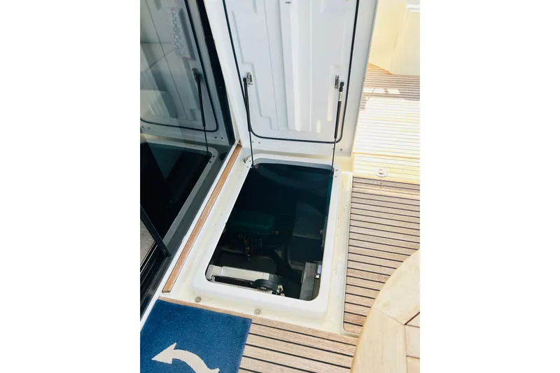 Billy Yacht Photos Pics Engine compartment access on 2014 Beneteau Swift Trawler 50, featuring teak deck.