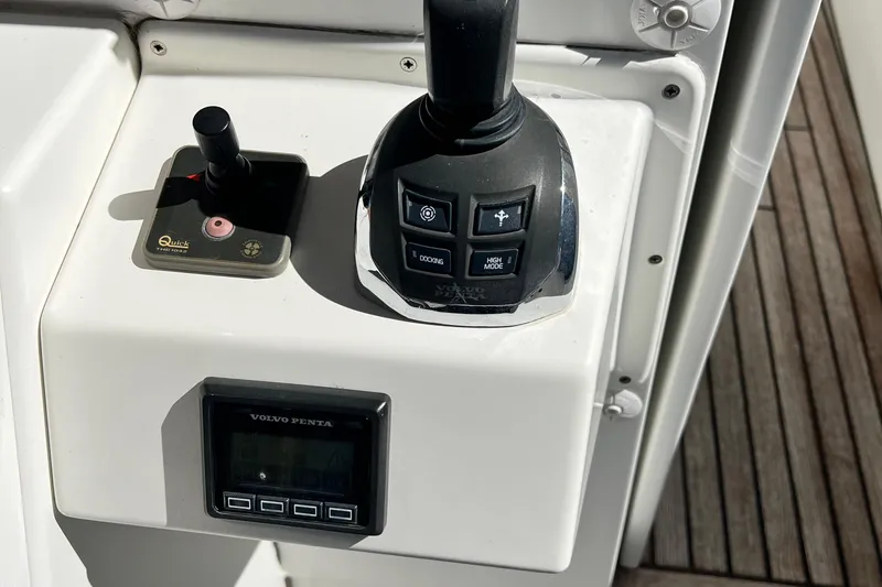 Billy Yacht Photos Pics Control panel of a 2014 Beneteau Swift Trawler 50 with joystick and Volvo Penta display.