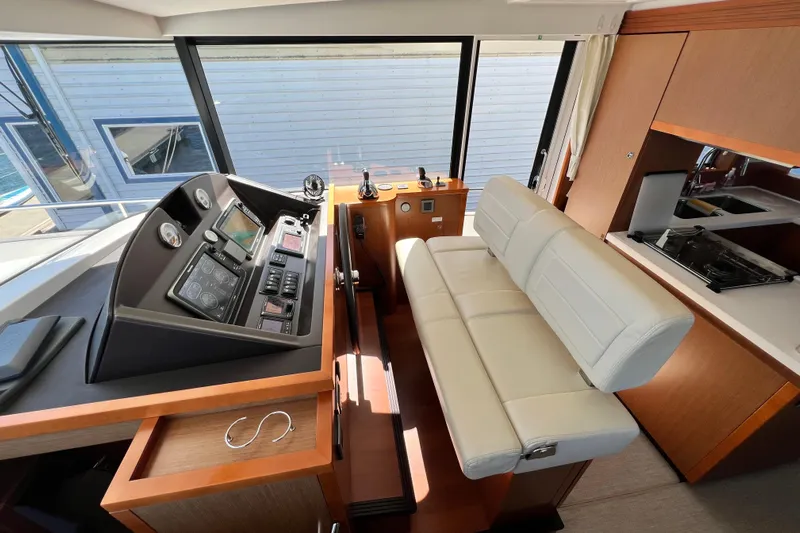 Billy Yacht Photos Pics Interior helm of 2014 Beneteau Swift Trawler 50 with modern controls and seating.