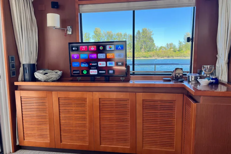 Billy Yacht Photos Pics Interior of 2014 Beneteau Swift Trawler 50 with TV and scenic window view.