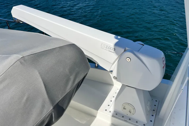 Billy Yacht Photos Pics Steelhead Marine ES1000 crane on 2014 Beneteau Swift Trawler 50, docked on calm water.