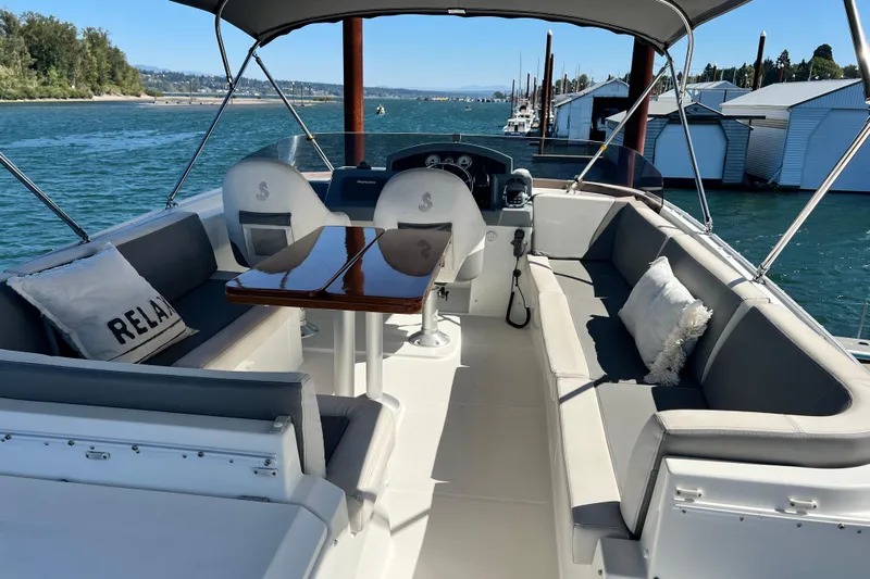 Billy Yacht Photos Pics Luxurious 2014 Beneteau Swift Trawler 50 with spacious seating and scenic waterfront view.