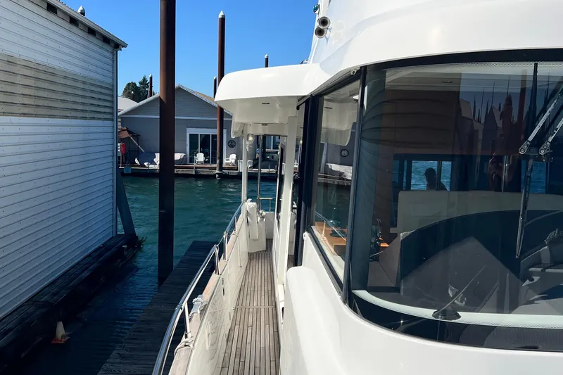 Billy Yacht Photos Pics 2014 Beneteau Swift Trawler 50 docked, showcasing sleek design and spacious deck.