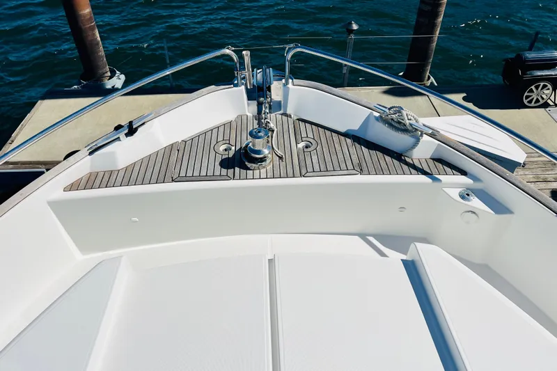 Billy Yacht Photos Pics Bow of 2014 Beneteau Swift Trawler 50 with teak decking at dock.