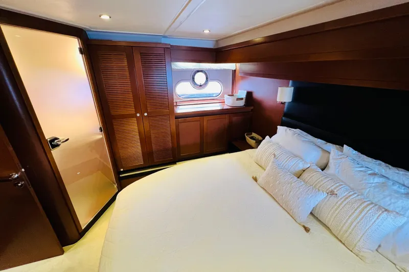 Billy Yacht Photos Pics Luxurious cabin interior of 2014 Beneteau Swift Trawler 50 with elegant wood finishes.