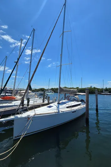  Yacht Photos Pics 2017 Jeanneau Sun Odyssey 389 sailboat docked under clear blue sky.