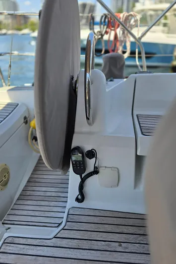  Yacht Photos Pics 2017 Jeanneau Sun Odyssey 389 cockpit with steering wheel and marine radio.