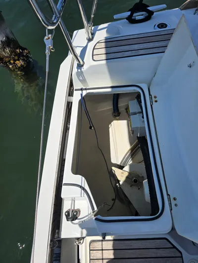  Yacht Photos Pics Open hatch on 2017 Jeanneau Sun Odyssey 389 sailboat, docked by water.