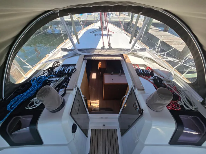  Yacht Photos Pics 2017 Jeanneau Sun Odyssey 389 sailboat cockpit with ropes and winches, docked at marina.