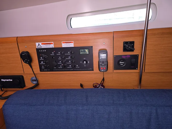  Yacht Photos Pics Control panel inside 2017 Jeanneau Sun Odyssey 389 sailboat, featuring navigation and communication equipment.
