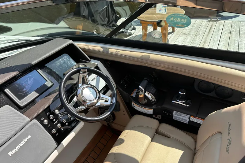  Yacht Photos Pics Interior cockpit of 2016 Sea Ray SLX 350 boat with steering wheel and controls.