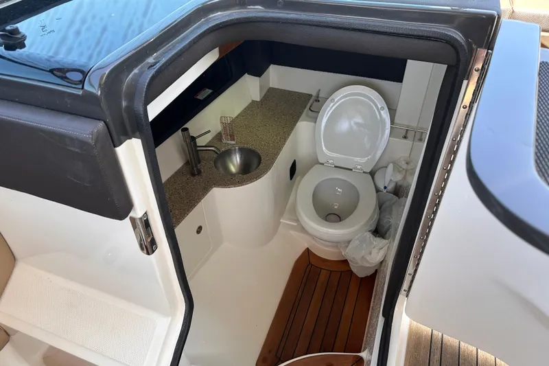  Yacht Photos Pics Interior of 2016 Sea Ray SLX 350 boat bathroom with toilet and sink.