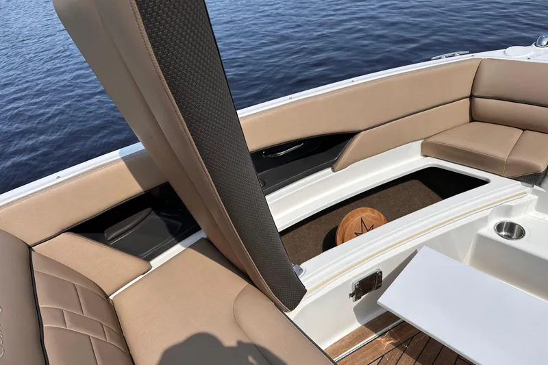  Yacht Photos Pics 2016 Sea Ray SLX 350 boat interior with tan seating and storage compartment.