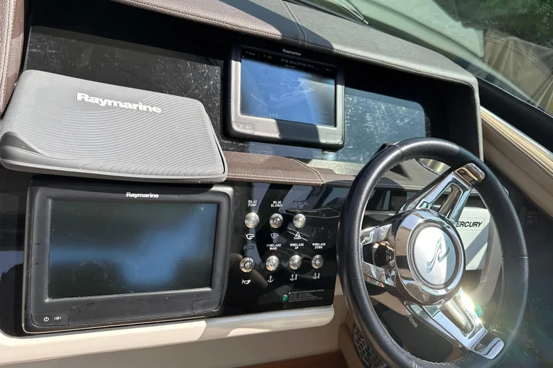  Yacht Photos Pics Dashboard of a 2016 Sea Ray SLX 350 boat with Raymarine navigation system.