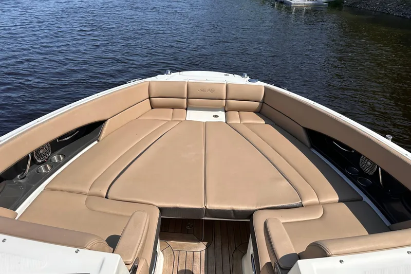  Yacht Photos Pics 2016 Sea Ray SLX 350 boat with spacious tan seating on calm water.