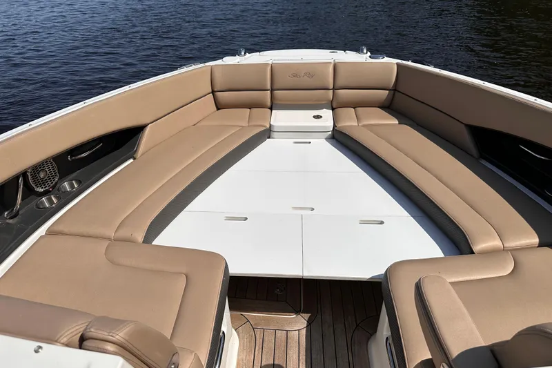  Yacht Photos Pics Luxurious seating area on a 2016 Sea Ray SLX 350 boat, overlooking calm waters.