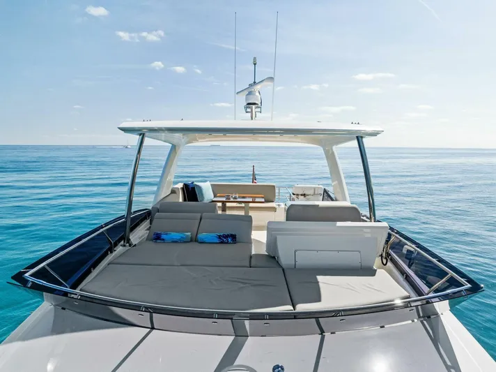 Anna Louise Yacht Photos Pics 2022 Prestige 590 Flybridge yacht on calm ocean waters.