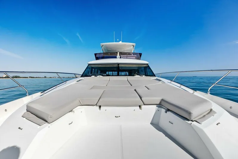 Anna Louise Yacht Photos Pics 2022 Prestige 590 Flybridge yacht with spacious deck and luxurious seating.