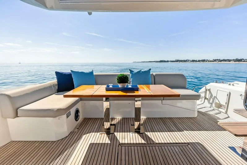 Anna Louise Yacht Photos Pics Prestige 590 Flybridge 2022 yacht deck with seating and ocean view.