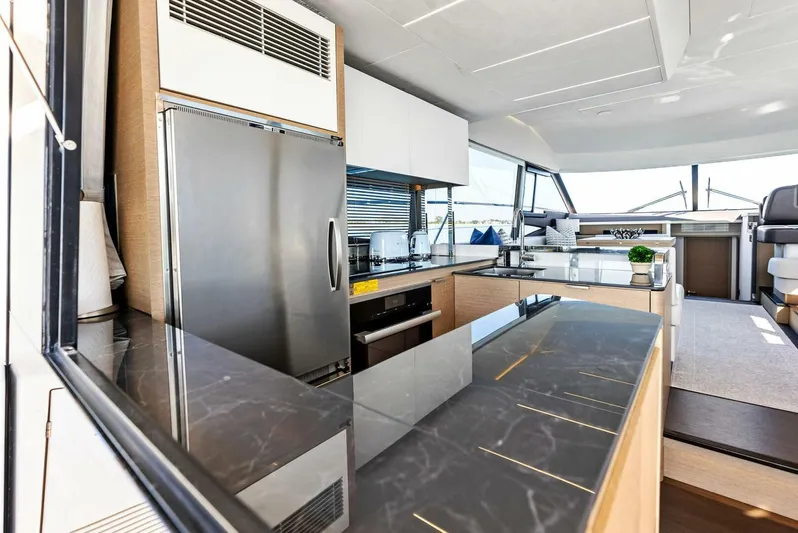 Anna Louise Yacht Photos Pics Luxurious kitchen interior of 2022 Prestige 590 flybridge yacht with modern appliances.