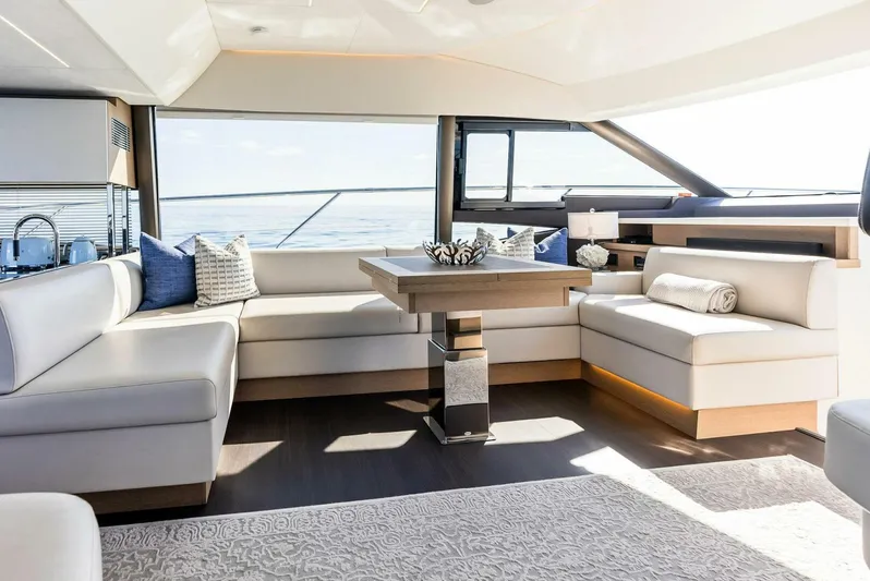 Anna Louise Yacht Photos Pics Luxurious interior of 2022 Prestige 590 flybridge yacht with elegant seating and modern decor.