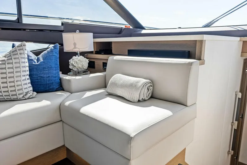 Anna Louise Yacht Photos Pics Luxurious seating area on 2022 Prestige 590 flybridge yacht with cushions and decor.