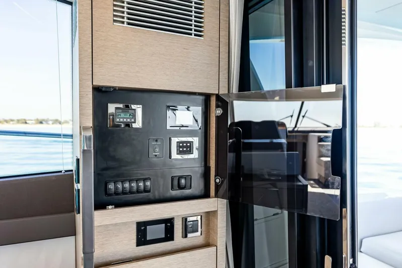 Anna Louise Yacht Photos Pics Control panel on a 2022 Prestige 590 Flybridge yacht, featuring modern navigation and system controls.
