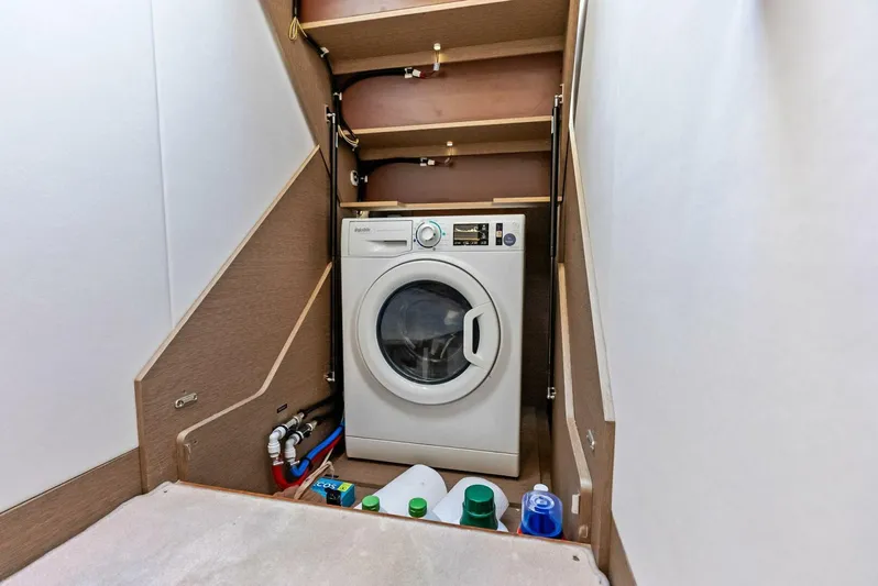 Anna Louise Yacht Photos Pics Laundry area with washing machine on 2022 Prestige 590 Flybridge yacht.