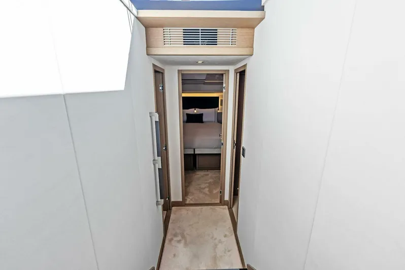 Anna Louise Yacht Photos Pics Hallway leading to bedroom on 2022 Prestige 590 Flybridge yacht.