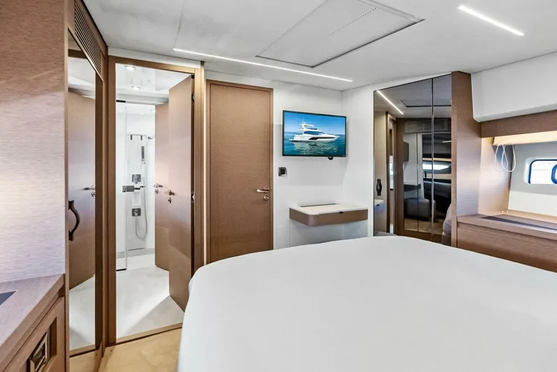 Anna Louise Yacht Photos Pics Luxurious interior of 2022 Prestige 590 flybridge yacht bedroom with modern amenities.