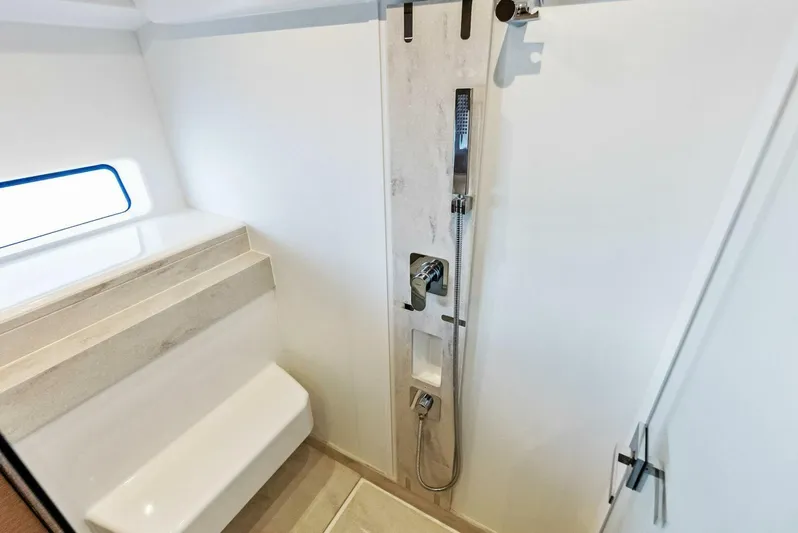 Anna Louise Yacht Photos Pics Luxury bathroom in 2022 Prestige 590 Flybridge yacht with modern shower design.