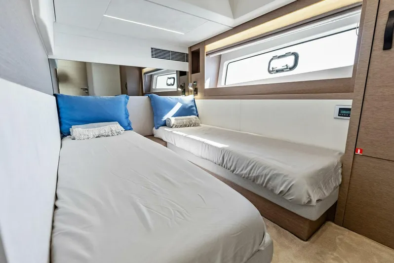 Anna Louise Yacht Photos Pics 2022 Prestige 590 Flybridge cabin with twin beds, modern design, and natural light.