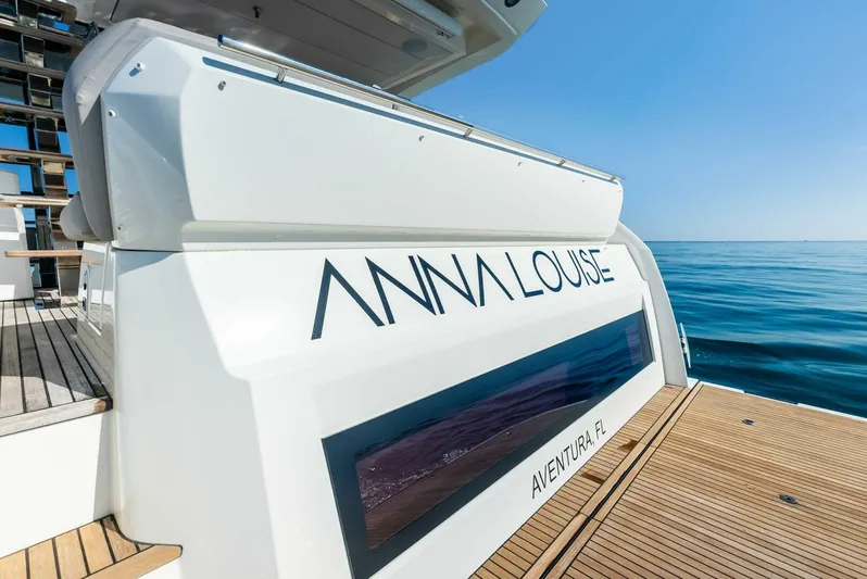 Anna Louise Yacht Photos Pics Prestige 590 flybridge yacht, 2022 model, docked with clear ocean view.